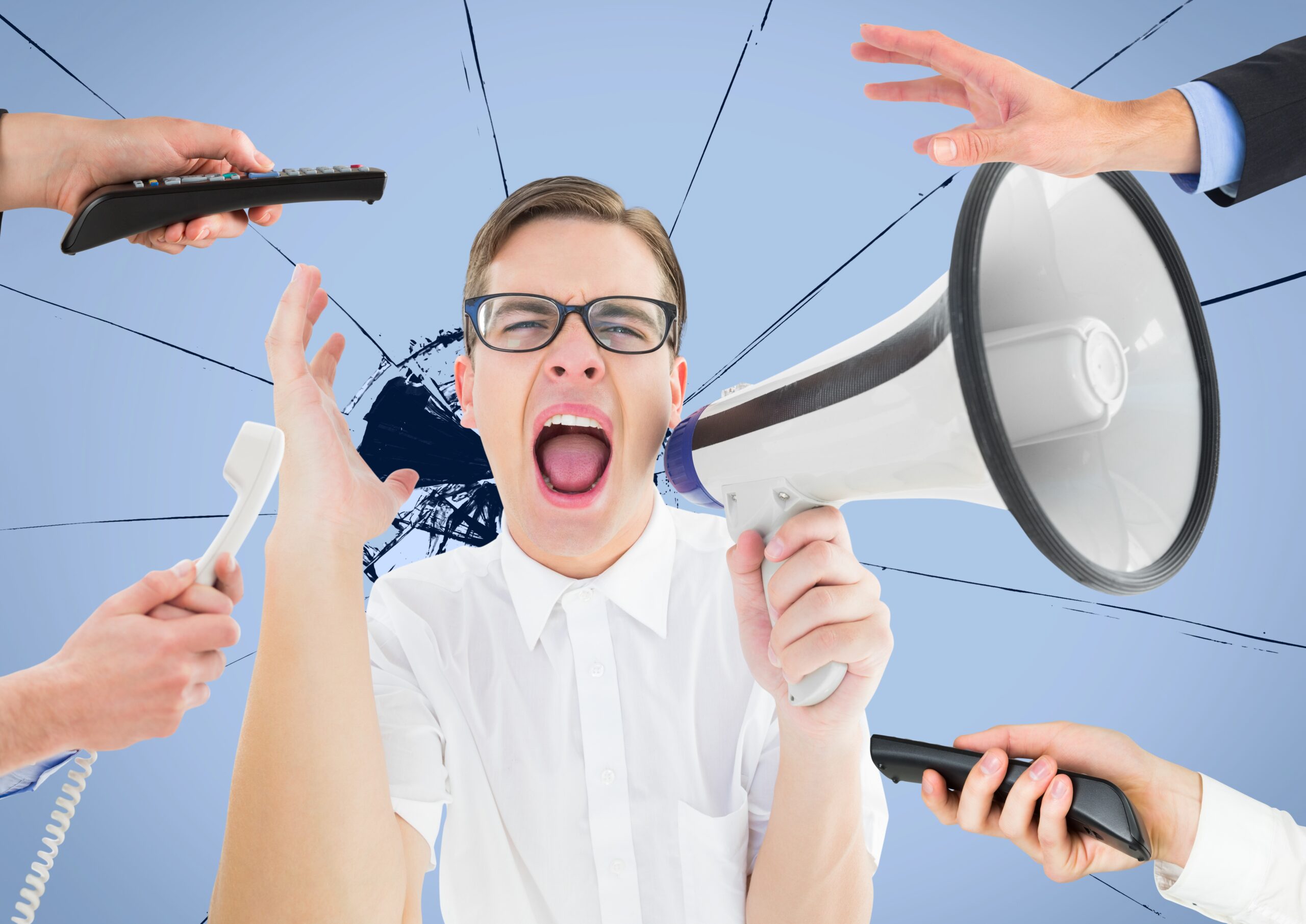 Male executive shouting on megaphone